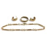 A bracelet, two ear studs, and a wedding band, size M. (4)