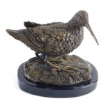 A 20thC bronze finish figure of a snipe, on oval base, unsigned, 17cm high.