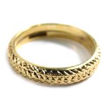 A 9ct gold wedding band, of hammered design, ring size M, 1.1g all in. (AF)