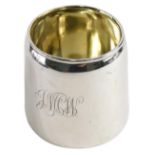 A George V silver and silver gilt jar, with tapering body, Birmingham 1928, initialled, 9cm high, 4.