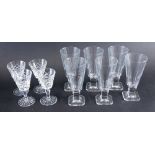 A set of four Waterford crystal sherry glasses, each hobnail cut 13cm high, and six further champagn