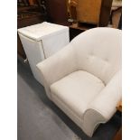 A beige upholstered tub chair, on plain beech feet, and a LEC Elan fridge. (2)