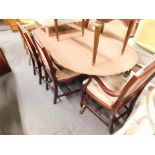 A mahogany finish D end extending table, and six (4+2) shield back chairs.