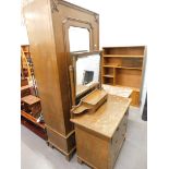 An oak three piece bedroom suite, comprising single mirrored door wardrobe, mirror back dressing che