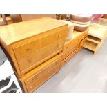 A collection of furniture to include three retro teak chest of drawers, two pouffes. The upholstery