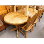 A heavy oak refectory style oblong table, with four chairs.