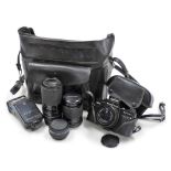 A Praktica BN Electronic camera with a Pentacon 50mm lens, a 2.8-135 lens, 4.5-5.6-80-200 zoom lens,