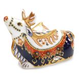 A Royal Crown Derby porcelain Reindeer paperweight, red printed marks and gold stopper, 10cm high, b