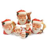 A group of Royal Doulton pottery Santa Claus character and Toby jugs, comprising three character jug