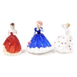 Three Royal Doulton porcelain figures, comprising Molly, HN4091, Mary, figure of the year 1992, HN33