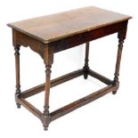 A 19thC oak side table, of plain form, with a rectangular top, with a moulded edge, on turned legs w