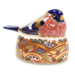 A Royal Crown Derby porcelain Bullfinch Nesting paperweight, red printed marks and silver stopper, 7