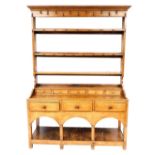 A late 18th/early 19thC oak dresser, the raised back with cup hooks and four plate shelves, the base