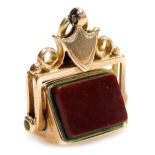 A 9ct gold bloodstone and carnelian swivel fob, with a shield shaped mount, 6.2g.