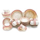 A late 19thC Staffordshire porcelain tea service, decorated in pink and gilt, comprising a pair of b