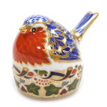 A Royal Crown Derby porcelain Robin Nesting paperweight, red printed marks and gold stopper, 7cm hig