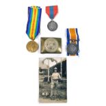 A pair of World War I medals, comprising The Great War and Victory medals, named to Cpl A E Wright,