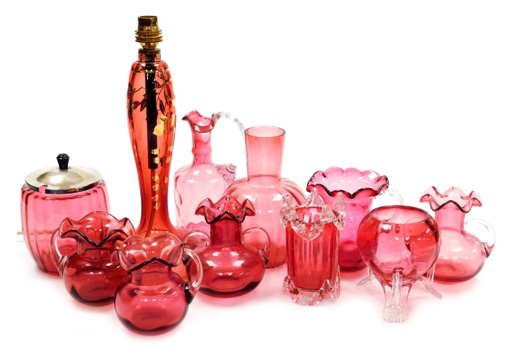 A group of 19thC and later cranberry coloured glass, to include a biscuit barrel with silver plated