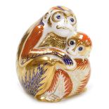 A Royal Crown Derby porcelain Mother and Baby Monkey paperweight, red printed marks and gold stopper