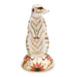 A Royal Crown Derby porcelain Meerkat paperweight, red printed marks and gold stopper, 13.5cm high,