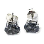 A pair of Rutilated Quartz stud earrings, each with an oval stone, in four claw basket setting, on s