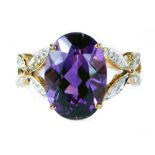 A 9ct gold amethyst and diamond dress ring, with large oval amethyst, approx 5ct, in a four claw set