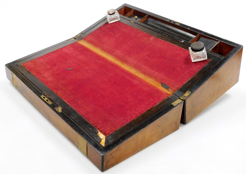 A Victorian walnut and brass bound writing slope, the hinged lid opening to reveal a red baize slope - Image 2 of 2