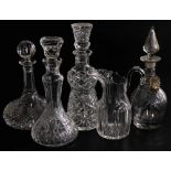 A group of cut glass decanters, comprising a ship's decanter and stopper, 30cm high, another of doub