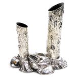 An Edward VII silver dual posy holder, modelled in the form of two tree trunks on a rocky base, Geor