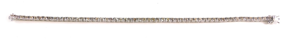 An 18ct white gold diamond line bracelet, set with round brilliant cut diamonds totalling, approx. 5