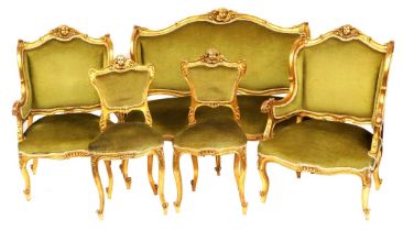 A late 19thC Continental parcel gilt salon suite, each carved with a cherub's head and floral crest