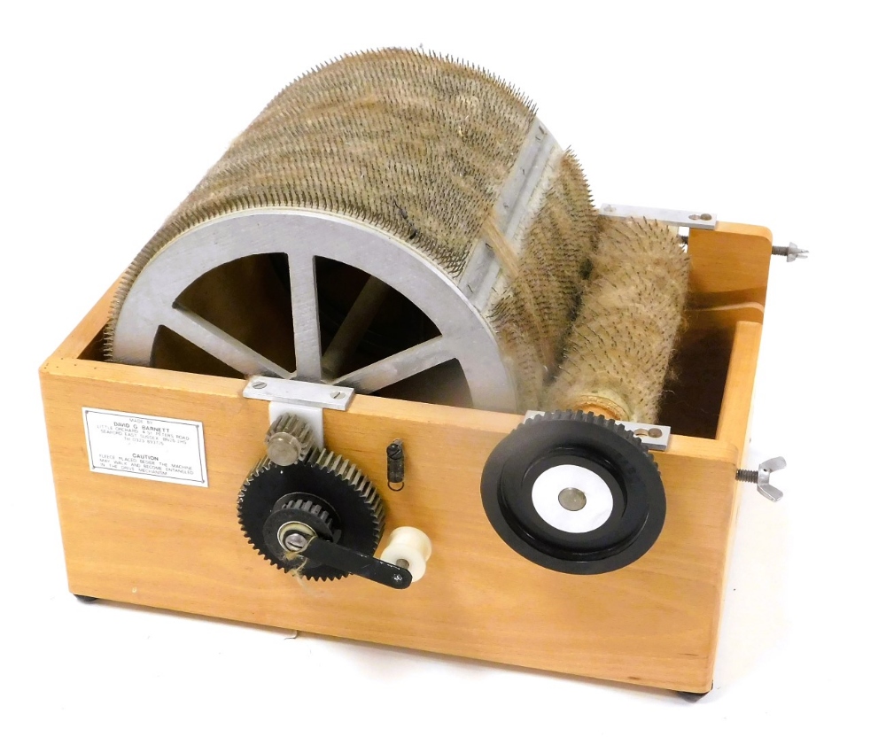 A Barnett Drum carder machine, with instructions, 34cm wide.