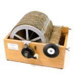 A Barnett Drum carder machine, with instructions, 34cm wide.