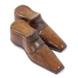 A pair of 19thC treen snuff boxes, modelled as shoes, 10cm wide.