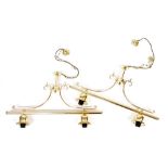 A pair of brass two branch ceiling lights, each mounted on cylindrical poles, 77cm wide.