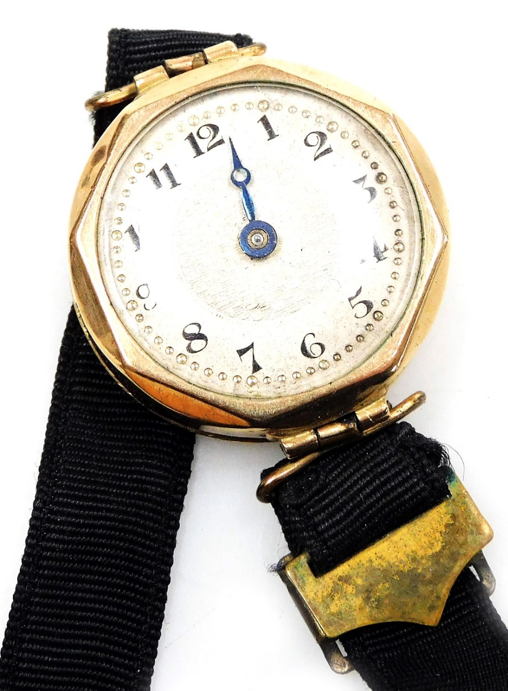 An early 20thC lady's 9ct gold cased wristwatch, circular silvered dial with engine turned decoratio