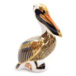 A Royal Crown Derby porcelain Brown Pelican paperweight, red printed marks and gold stopper, 14cm hi