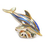 A Royal Crown Derby porcelain Dolphin paperweight, red printed marks and gold stopper, 18.5cm high.