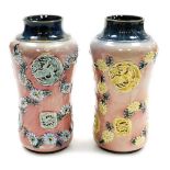 A pair of late 19thC Royal Doulton Lambeth stoneware vases, of cylindrical waisted form, decorated i