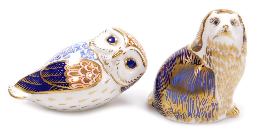 Two Royal Crown Derby porcelain paperweights, comprising Owl, 12cm wide, and Spaniel, 10cm high, bot