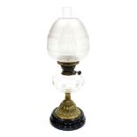 A late 19thC cut glass and brass oil lamp, with a clear and opaque floral etched shade, clear cut gl
