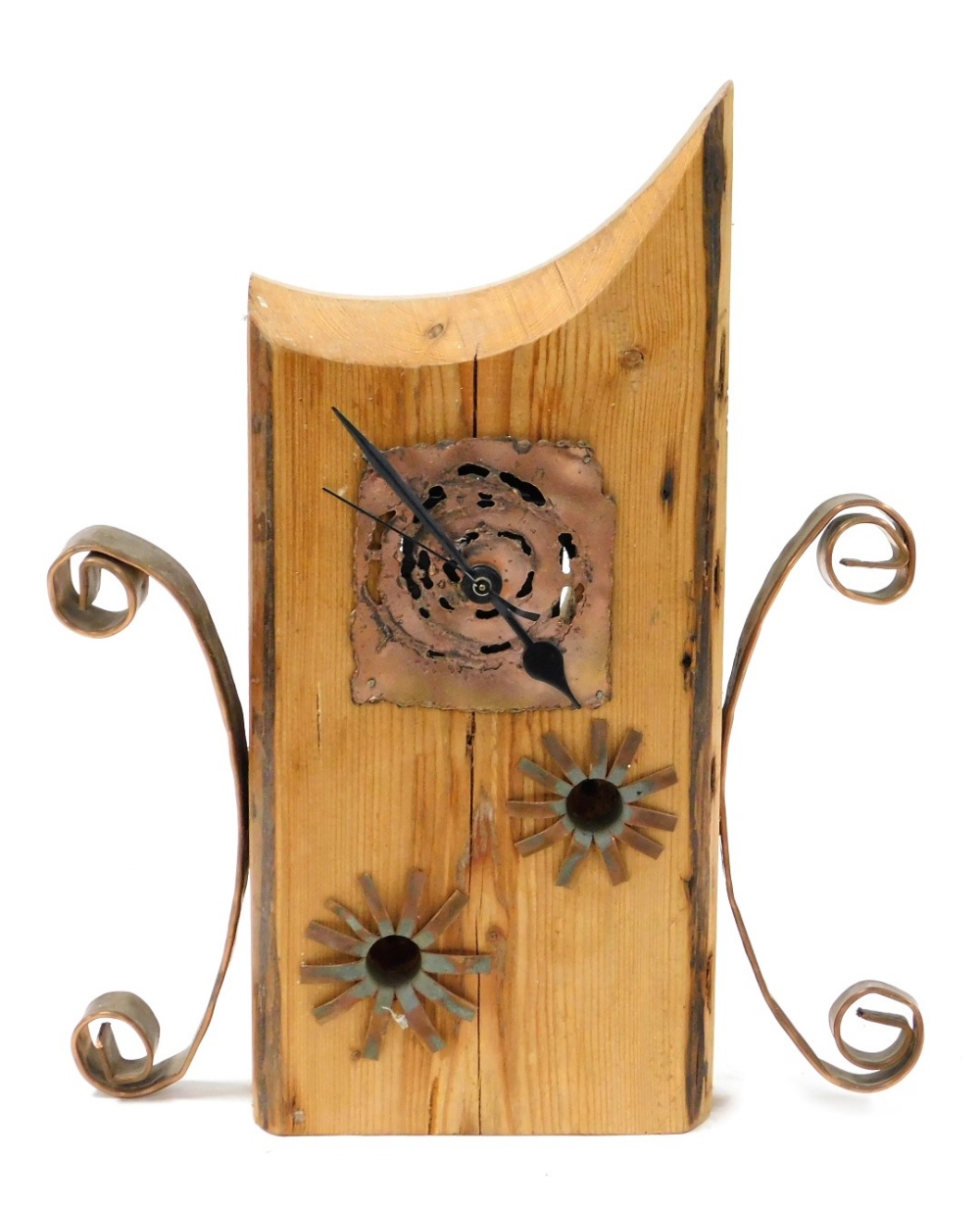 A modernistic pine and copper mantel clock, with a Hermle quartz movement, 38cm high.