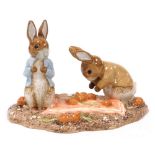 A Beswick pottery Beatrix Potter figure group, modelled as Peter and Benjamin Picking up Onions, lim