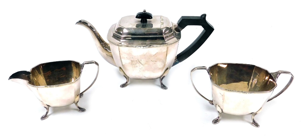 An Art Deco style community plate three piece tea set, comprising teapot, two handled sugar bowl, an