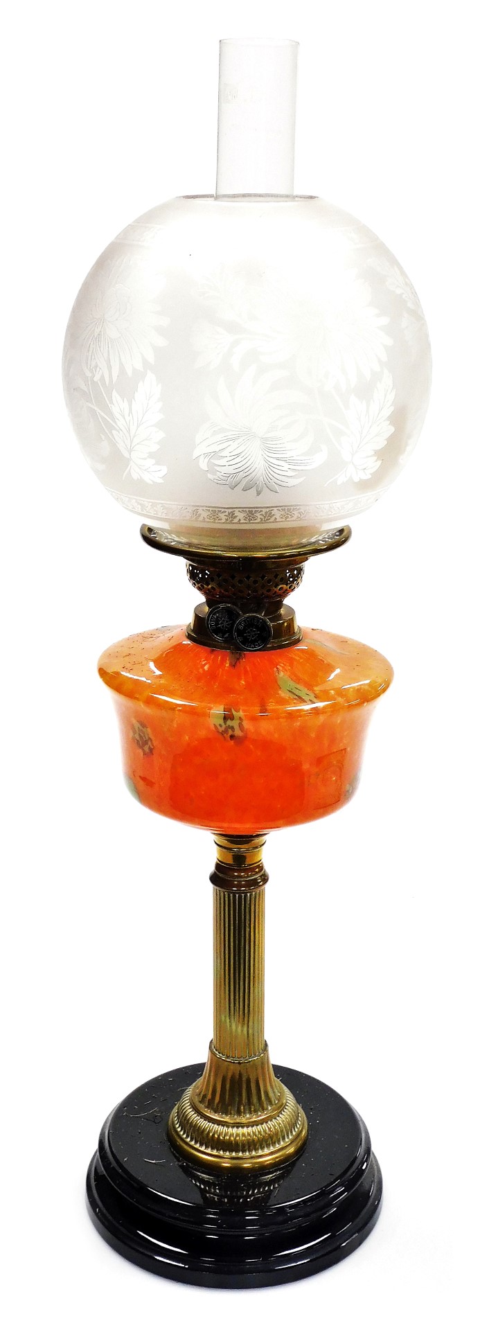 A late 19thC brass and glass oil lamp, with an acid etched floral decorated shade, clear glass chimn