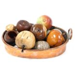 A vintage copper cooking pot, containing wooden fruit and other apples, and simulated birds eggs. (a