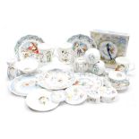A group of Royal Doulton The Snowman porcelain, including three money boxes, teacup and saucer, mug,