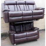 A 20thC brown leather three seater manual reclining sofa, together with a matching two seater sofa.