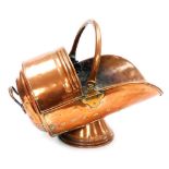 A Victorian copper helmet shaped coal scuttle, 28cm high.