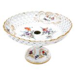 A Dresden porcelain comport, the pierced bowl painted with sprays of flowers, gilt heightened, on a